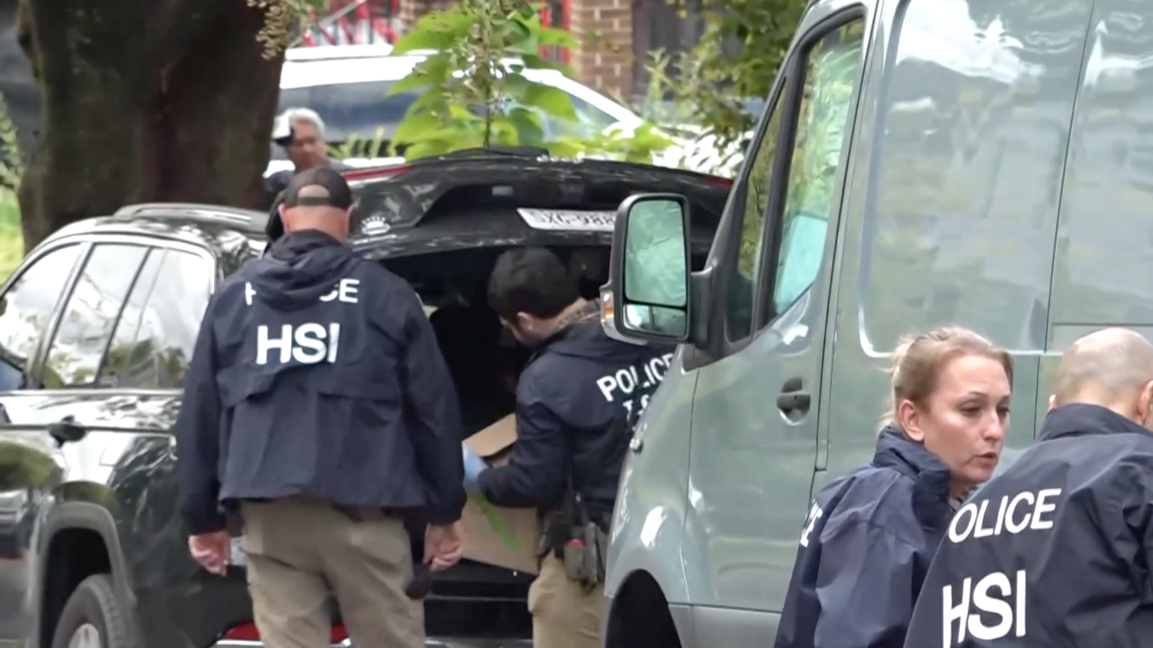 HSI agents with boxes outside Ilhan Omar’s home
