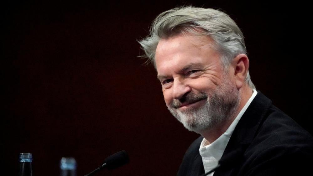 Sam Neill: A Legend of Film and Charity – Remembering the Jurassic Hero