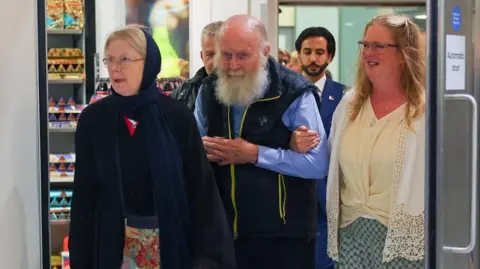 British Couple Freed from Taliban Custody Arrive Back Home