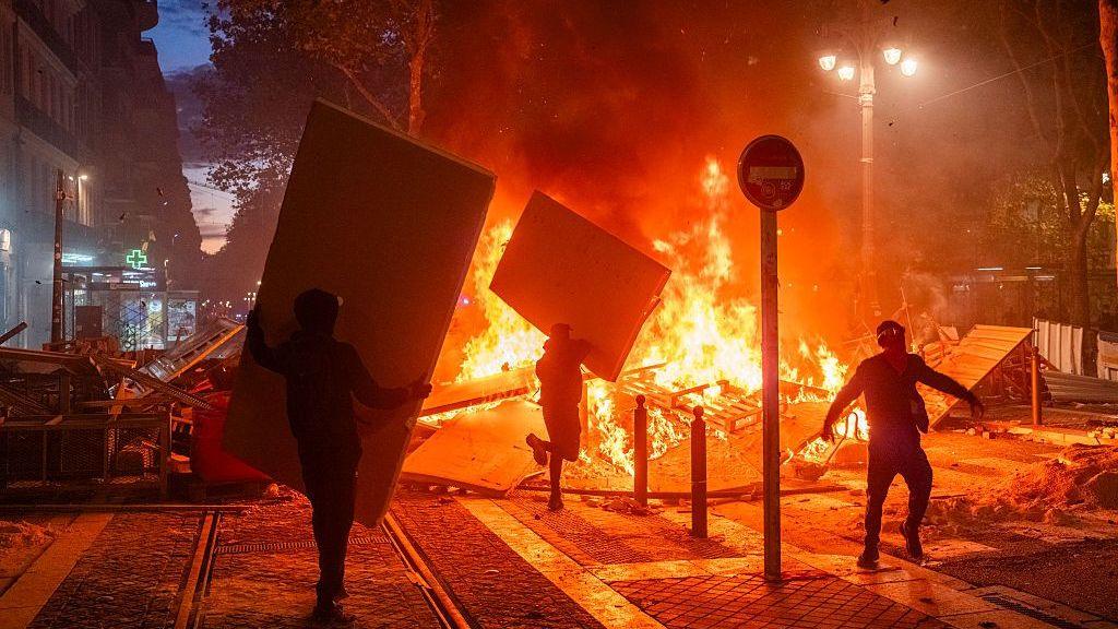 Fire engulfing a boulevard in Marseille during a riot