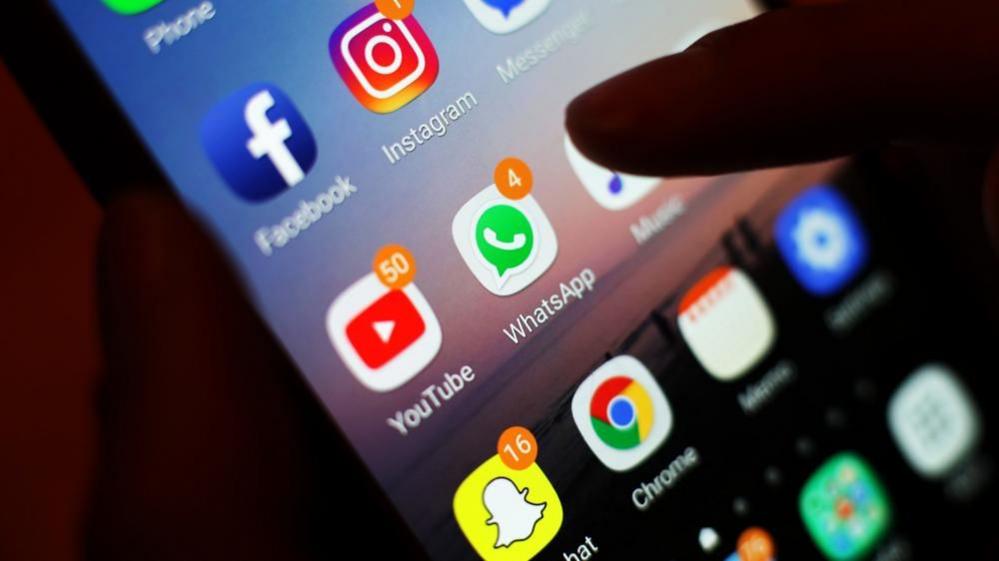 Icons of social media apps displayed on a mobile phone screen