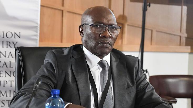Charges dropped against South Africa police intelligence chief
